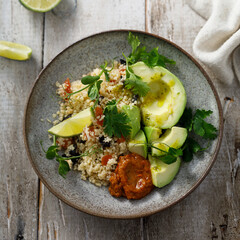 Couscous bowl with avocado and pepper sauce