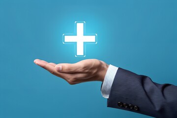 Hand holding a glowing plus sign for healthcare