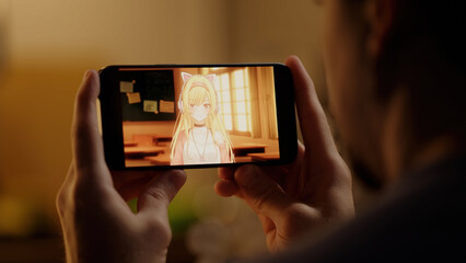 Watching Japanese anime with cute anime girls on smartphone with kitchen in background