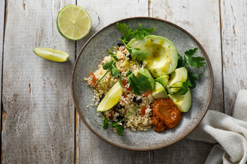 Couscous bowl with avocado and pepper sauce