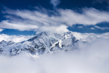 Caucasian mountains Donguz-orun and Nakra summits in clouds. Main Caucasus range, view from the Mt....