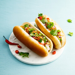 Hot dogs with red pepper and cilantro