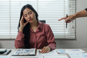 Stressed asian businesswoman blamed by manager in office meeting