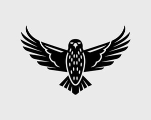 Obraz premium Stylized black hawk with wings spread wide