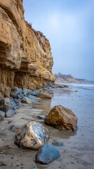 Fototapeta premium Coastal cliffs meet a sandy beach