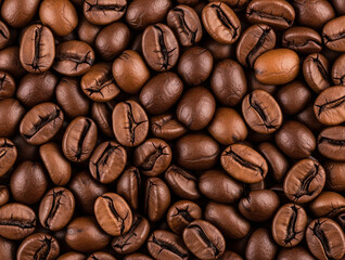 Naklejka premium Dark roasted coffee beans full of distinctive aroma tempting taste.