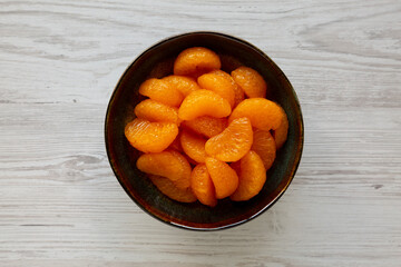 Organic Canned Mandarin Oranges in Bowls, top view. Flat lay, overhead.