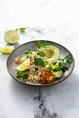 Couscous bowl with avocado and pepper sauce