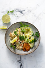 Couscous bowl with avocado and pepper sauce