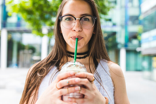 Portrait of teenage girl drinking milkshake