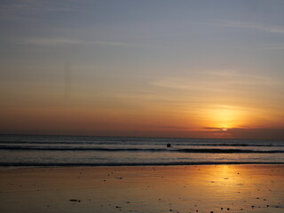 Bali’s sunset displays vibrant colors over the ocean, creating unforgettable, peaceful, and romantic moments daily.