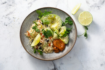 Couscous bowl with avocado and pepper sauce