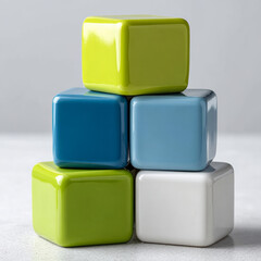 Stacked colorful ceramic cubes on a light background.