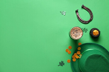 Mug of dark beer with leprechaun hat, horseshoe and decor for St. Patrick's Day celebration on...