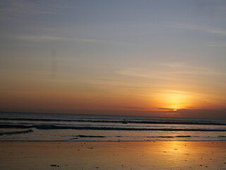 Bali’s sunset displays vibrant colors over the ocean, creating unforgettable, peaceful, and romantic moments daily.