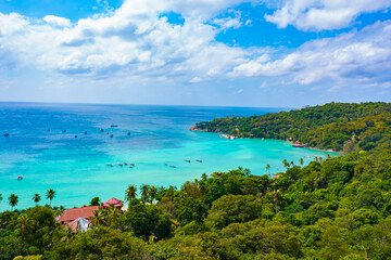 Aerail view of  tourist boat with green forest  island and the sea. natural ecosystems of forests in the oceans travel holiday concept
