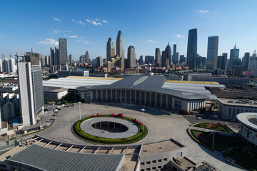 Aerial panorama of a major transportation hub in a thriving metropolis. A modern building with a...