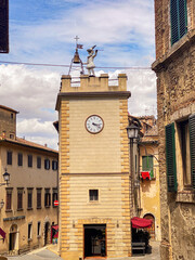 Obraz premium Torre di Pulcinella with its clock and automated bell ringer in Montepulciano, Italy, a popular tourist destination in Tuscany