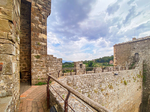 Stone walls and ramparts of the medieval fortress in Montalcino, Siena, offer breathtaking views of the Tuscan countryside