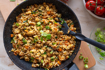 Fried rice with egg and vegetables. Healthy vegetarian food