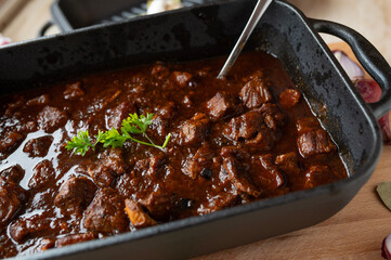 Brown ale goulash with pork and beef meat. Traditional german cuisine fresh and homemade cooked in...