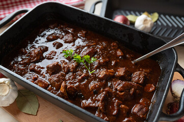 Brown ale goulash with pork and beef meat. Traditional german cuisine fresh and homemade cooked in...