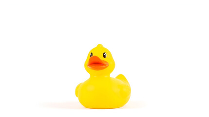 Fototapeta premium A bright yellow rubber duck with a playful expression, against a white backdrop.