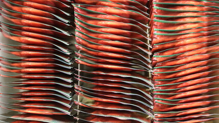 Abstract background of red and green tea bags in a large metallic wrapper, seen from above