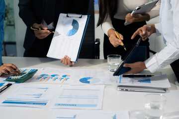 business team working on a project in the office or reviewing and discussing a business project.