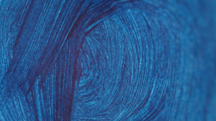 Abstract shof large, sweeping, dark blue watercolor brushstroke on textured white paper. Paint showing distinct linear brush bristles textured layered. Color and texture large curved stroke movement