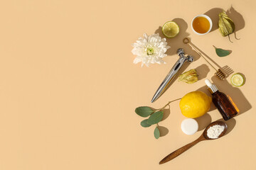 Massage roller and natural ingredients for cosmetic mask on beige background