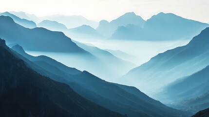 Serene Blue Mountainscape Misty Layers of Peaks and Valleys at Dawn.