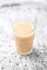 Pineapple coconut smoothie on bright background. Soft focus. Copy space.	
