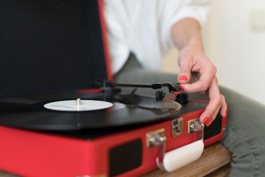 Woman using record player, close-up