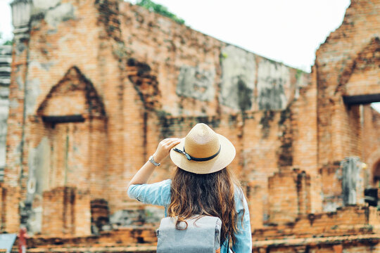 Young asian woman traveler traveling in Ayutthaya, Thailand. Travel concept.