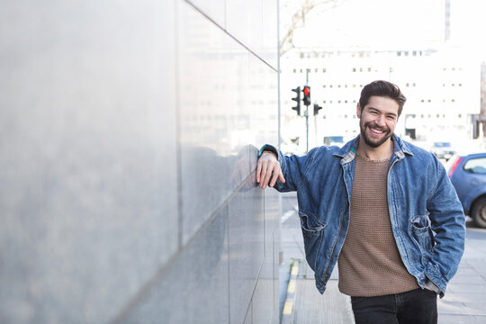 Portrait of bearded young man in the city