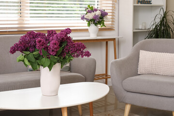 Lilac flowers on coffee table in living room