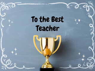 Golden trophy presented to the best teacher with decorative chalk border on a blackboard