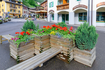 The Centre of the alpine town of Moena in Trentino, Italy with beautiful flowers