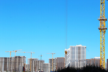 construction site with cranes, construction of new buildings in the city