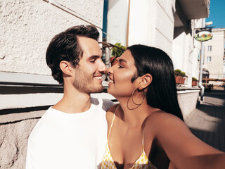 Smiling beautiful woman and her handsome boyfriend. Happy cheerful family. Sexy couple posing in...