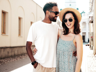 Smiling beautiful woman and her handsome boyfriend. Woman in casual summer clothes. Happy cheerful...