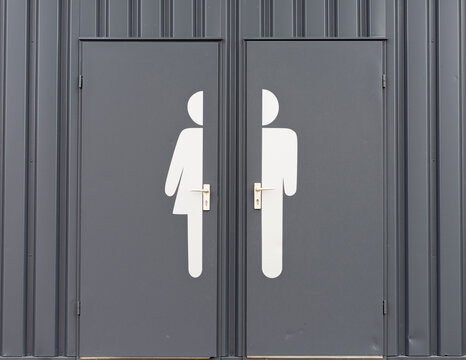 Germany, Male and female sign on toilet door