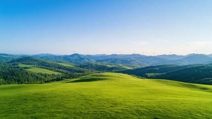 Vast, lush green landscape with rolling hills under clear blue sky, featuring distant wind turbines on horizon. serene scene evokes sense of tranquility and sustainable energy