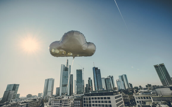 Germany, Frankfurt, cloud balloon in front of financial district