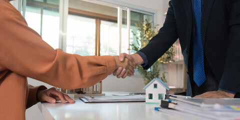 Real Estate Transaction. Handshake and key exchange between agent and buyer.