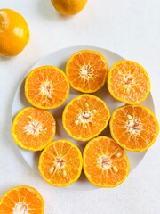 Top View of Freshly Cut Tangerines on Plate