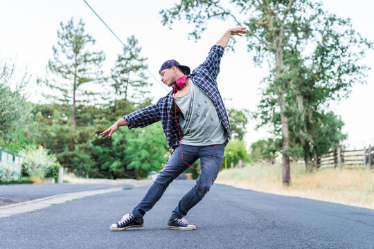 Young man dancing on street