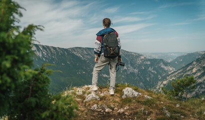 Fototapeta premium Outdoor travel lifestyle woman photographer shooting photo camera, travel adventure concept