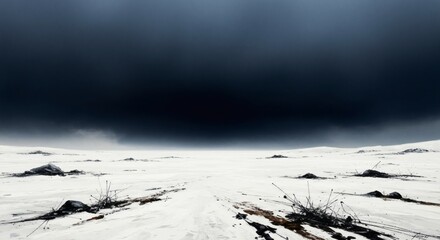 Stark snowy landscape under a dark stormy sky